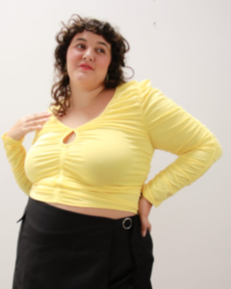 Front of a model wearing a size L Pucker Up Cutout Ruched Top in Lemon by Lovefool. | dia_product_style_image_id:249701